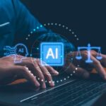 Person typing on a laptop with AI and legal symbols displayed