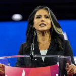 Person speaking at a podium during an event