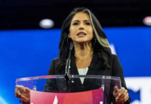 Person speaking at a podium during an event