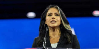 Person speaking at a podium during an event