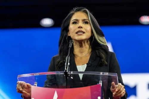 Person speaking at a podium during an event