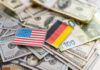 USA and Germany flags on various currencies