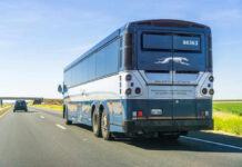 Feds Investigate Chinese Bus Driver Who Killed 5 Americans Rear view of a blue intercity coach bus on a highway