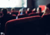 People watching a movie in a theater