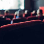People watching a movie in a theater