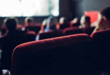 People watching a movie in a theater