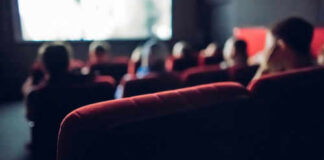 People watching a movie in a theater
