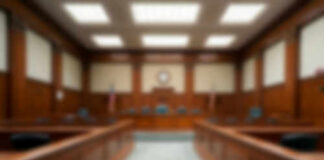 Blurred view of a courtroom with wooden furnishings