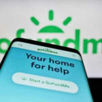 Screenshot About Violence Engulfs School Chief Smartphone displaying GoFundMe app with logo background