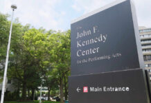 What Happened Outside The Kennedy Center? Sign for the John F. Kennedy Center for the Performing Arts with trees in the background