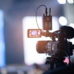 Close-up of a video camera set up for filming