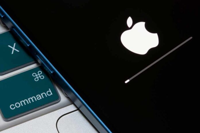 Portland,,Or,,Usa,-,Apr,19,,2023:,Closeup,Up,Of Apple logo displayed on a black screen with a loading bar
