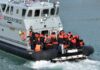 Belfast Attack Sparks Border Scrutiny Border Force boat with migrants wearing life jackets