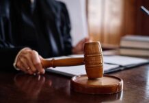 The Verdict Was Fast. The Warning Was Chilling A judge's hand holding a gavel in a courtroom setting