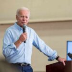 Biden Tapes Unsealed—What’s He Hiding? man speaking into a microphone at a podium
