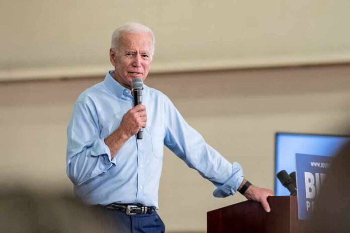 man speaking into a microphone at a podium