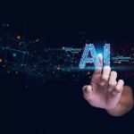 Hand touching glowing AI text with digital network nodes