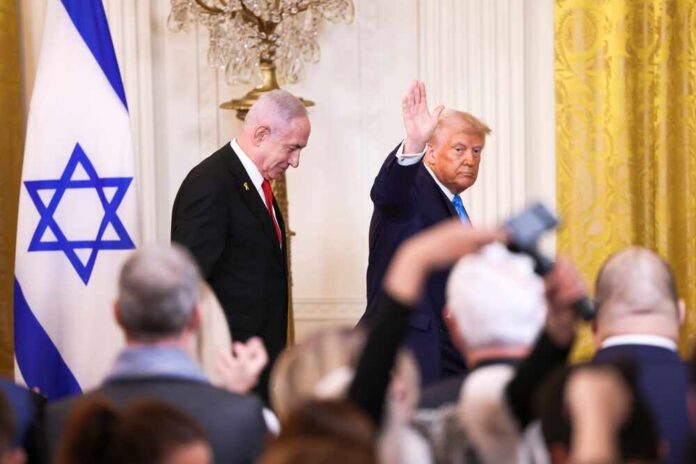 Washington,,Dc,,Usa,-,February,4,,2025:,President,Donald,J. Two suited men at a formal event with an Israeli flag and audience