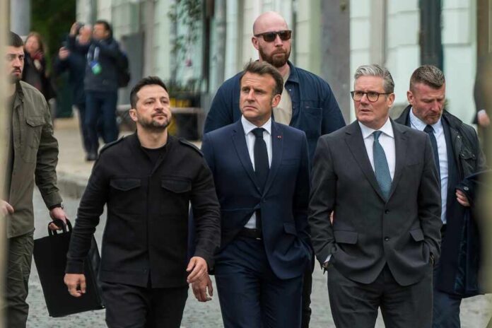 Ukrainian,President,Volodymyr,Zelensky,,French,President,Emmanuel,Macron,,And,Uk Group of political leaders walking together with security personnel