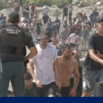 Thousands of migrants surge into Spanish enclave in North Africa