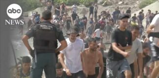 Thousands of migrants surge into Spanish enclave in North Africa