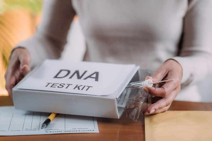 Person handling a DNA test kit with swabs on a table