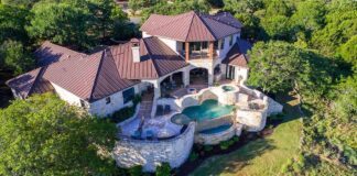 Luxury hillside stone mansion with tiered pool and spa