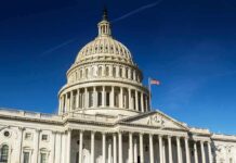 United States Capitol dome against clear blue sky