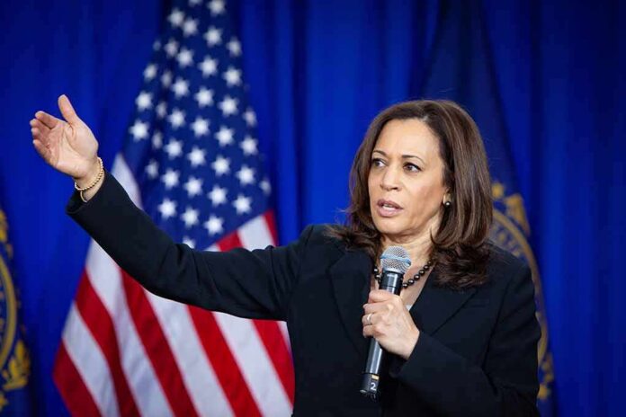 Kamala Harris speaking with microphone and gesturing on stage