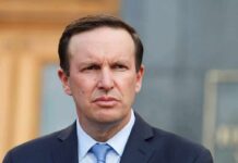 Internet Crackdown Floated To Cripple Trump Chris Murphy in a navy suit and blue tie outdoors