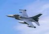 Fighter jet banking in the sky