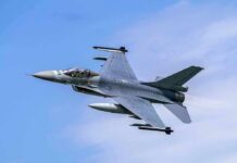 Fighter jet banking in the sky