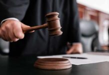 Judge using a wooden gavel in a courtroom