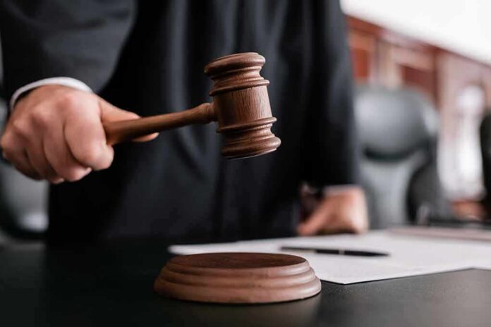 Judge using a wooden gavel in a courtroom