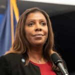 Woman speaking at a press conference microphone
