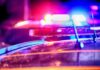 Police car light bar flashing at night