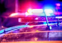 Police car light bar flashing at night