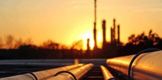 Industrial pipelines at sunset