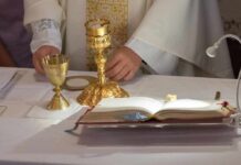 Faith Fight: Convert Or Go Quiet? Priest at altar with chalices and open book