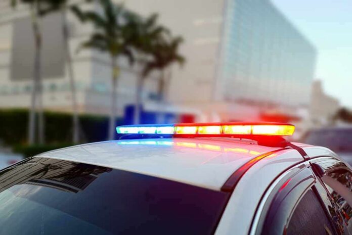 Police car roof with flashing red and blue lights