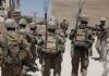 Multi-Front Chaos Drill Sparks 1973 Flashbacks soldiers in desert fatigues with radio packs and antennas