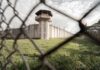 Statewide Manhunt After Prison Gate FAIL Prison watchtower behind chain-link fence