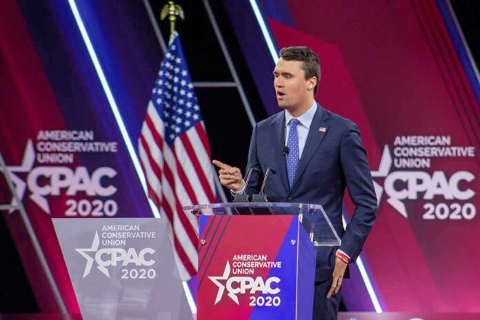 Speaker in suit at CPAC podium on stage