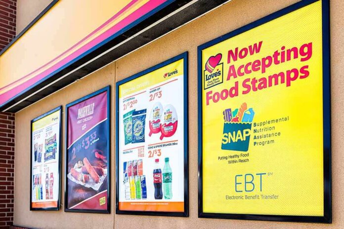 shutterstock_1713022039 Store window posters advertising SNAP EBT acceptance and product deals